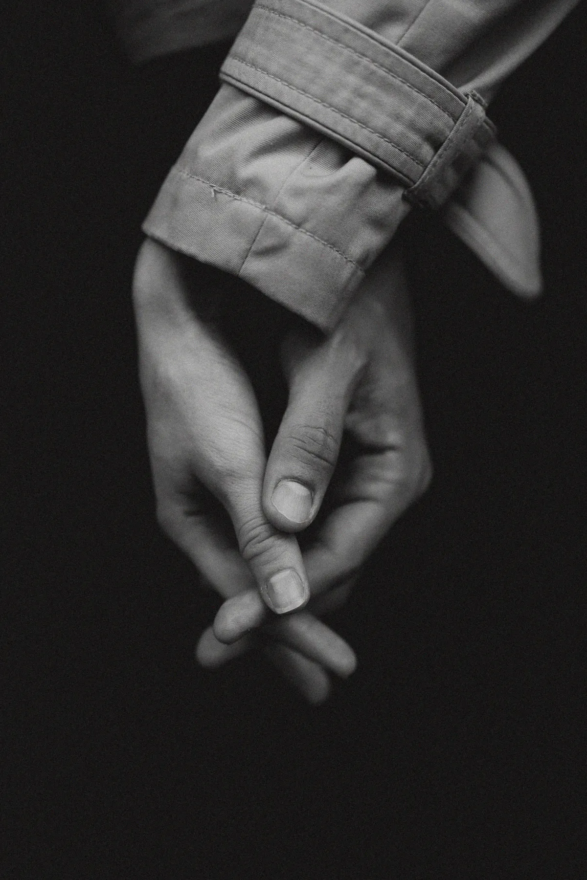 Intertwined hands, black and white